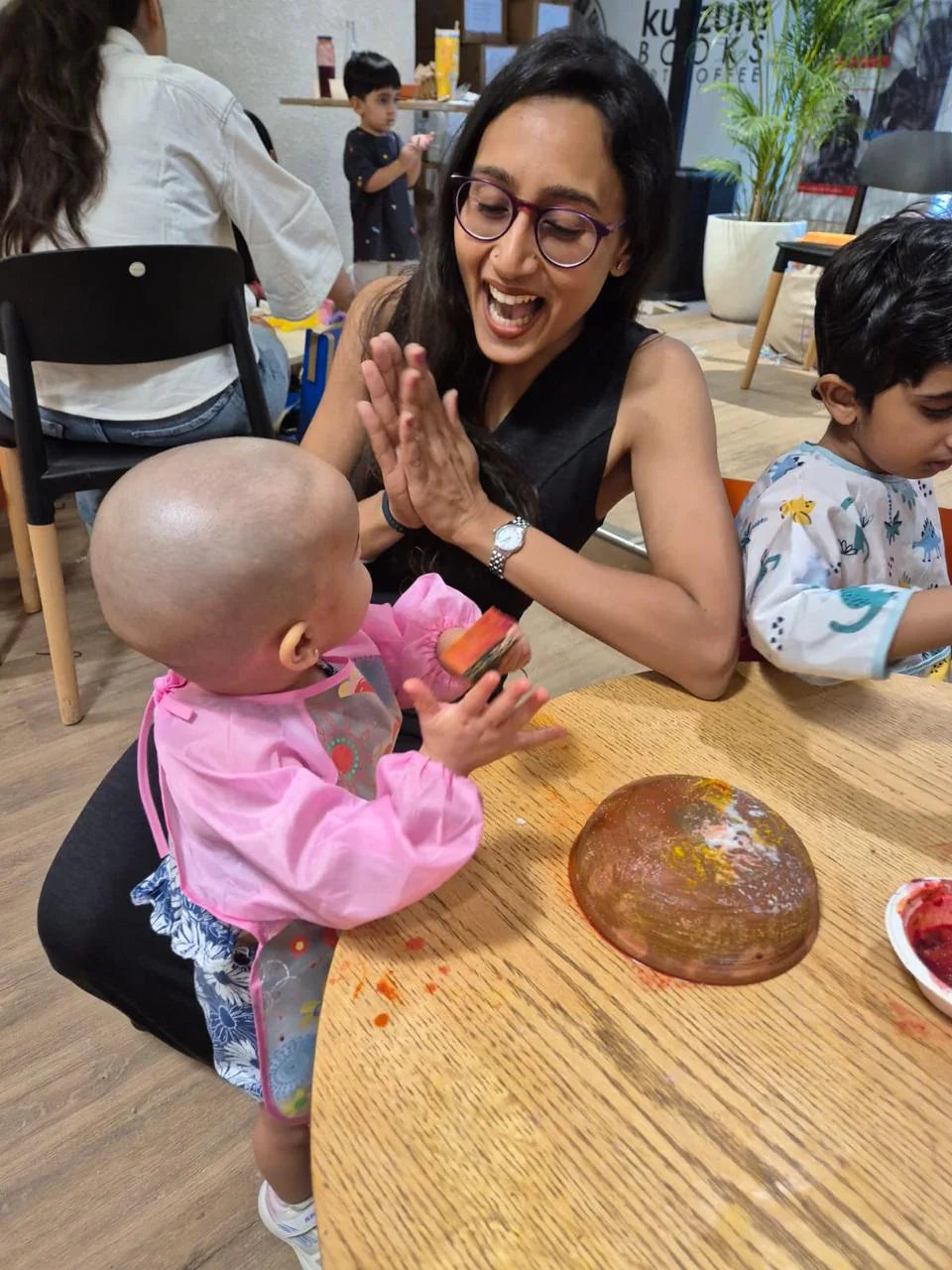 Vidushi Rajoria sharing a playful learning moment with a young child at Little Cambridge